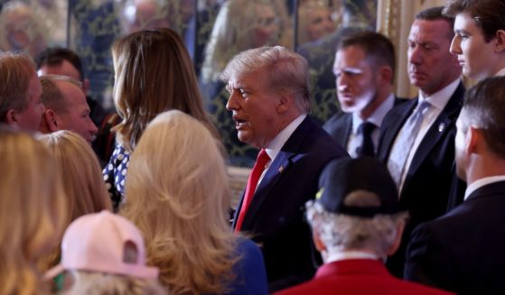Former President Donald Trump greets people during an event at his Mar-a-Lago home in Palm Beach, Florida, on Tuesday.