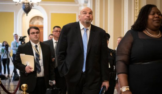 Sen-elect John Fetterman head to a lunch meeting with Senate Democrats at the U.S. Capitol in Washington, D.C., on Tuesday.