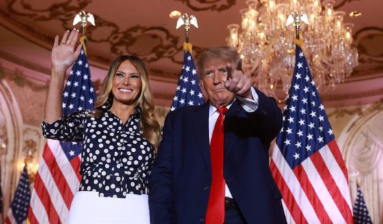 Former President Donald Trump and former first lady Melania Trump stand together at Trump's announcement Tuesday that he will seek the presidency in 2024.