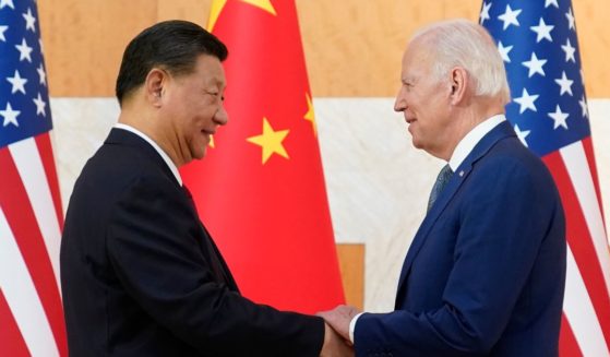 U.S. President Joe Biden, right, and Chinese President Xi Jinping, left, shake hands before their meeting on the sidelines of the G20 summit meeting in Nusa Dua, in Bali, Indonesia, on Monday.
