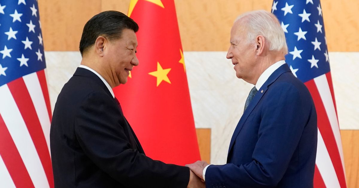 U.S. President Joe Biden, right, and Chinese President Xi Jinping, left, shake hands before their meeting on the sidelines of the G20 summit meeting in Nusa Dua, in Bali, Indonesia, on Monday.