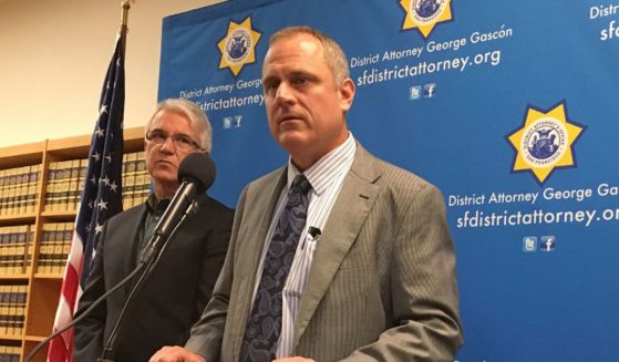 San Francisco elections director John Arntz, right, stands with San Francisco DA George Gascon, left, discussing election security during a news conference in San Francisco, California, on Nov. 1.