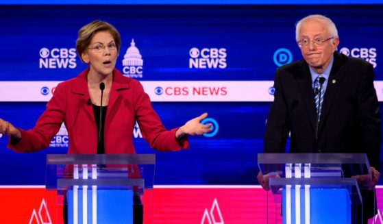 Massachusetts Sen. Elizabeth Warren and Vermont Sen. Bernie Sanders are pictured in a file photo from a Democratic presidential primary debate in February 2020.