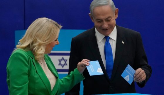 Likud party chairman Benjamin Netanyahu and his wife 'Sara cast their ballots during Israeli election in Jerusalem, Israel on Tuesday.