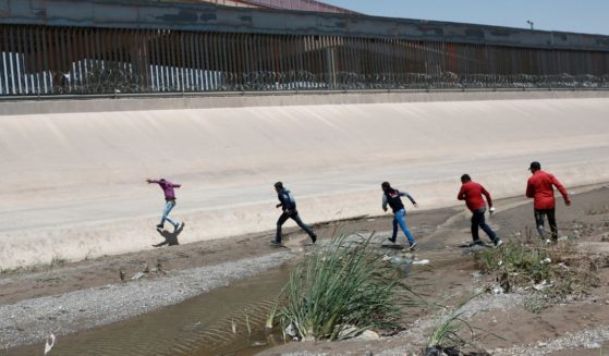 Migrants cross the Rio Bravo illegally on the U.S.-Mexico border between Ciudad Juarez, Mexico, and El Paso, Texas, on June 15, 2019.