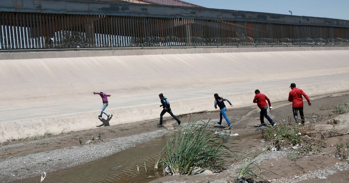 Migrants cross the Rio Bravo illegally on the U.S.-Mexico border between Ciudad Juarez, Mexico, and El Paso, Texas, on June 15, 2019.