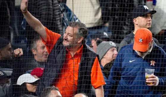 Senator Ted Cruz waves to spectators while attending Game 4 of an American League Championship baseball series between the New York and the Houston Astros in New York on Oct. 23.