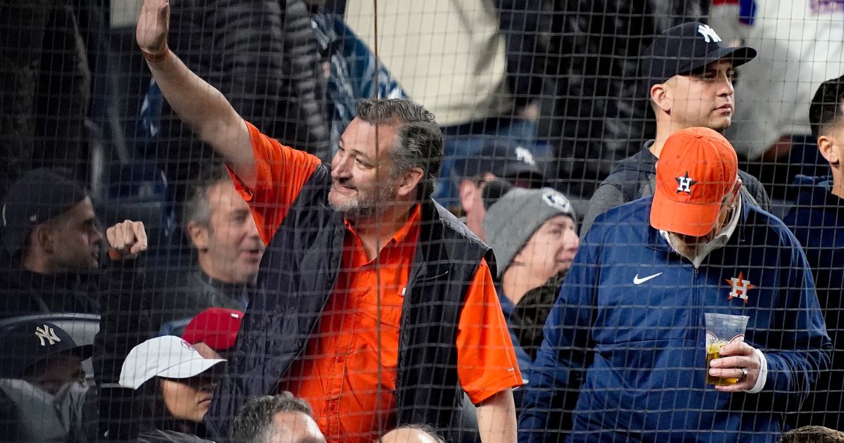 Senator Ted Cruz waves to spectators while attending Game 4 of an American League Championship baseball series between the New York and the Houston Astros in New York on Oct. 23.