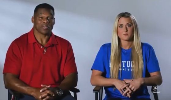 Georgia Senate candidate Herschel Walker appears in a campaign ad with former University of Kentucky swimmer Riley Gaines.
