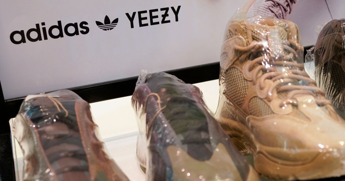 a sign advertising Yeezy shoes made by Adidas