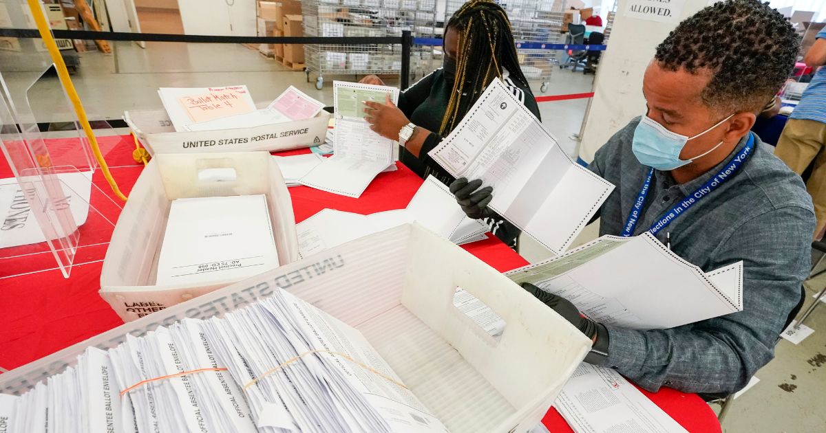 New York City Board of Election staff members counting absentee ballots