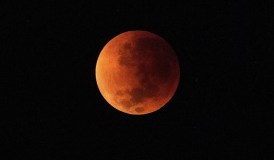 The blood moon is seen during a total lunar eclipse in Rio de Janeiro on May 16, 2022.