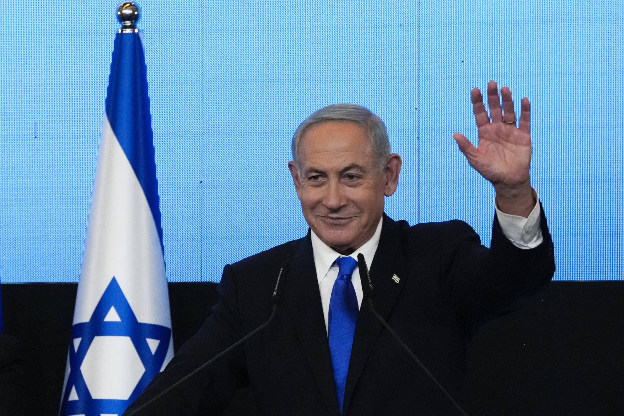 Benjamin Netanyahu, former Israeli Prime Minister and the head of Likud party, waves to his supporters after first exit poll results for the Israeli Parliamentary election at his party's headquarters in Jerusalem on Nov. 2.