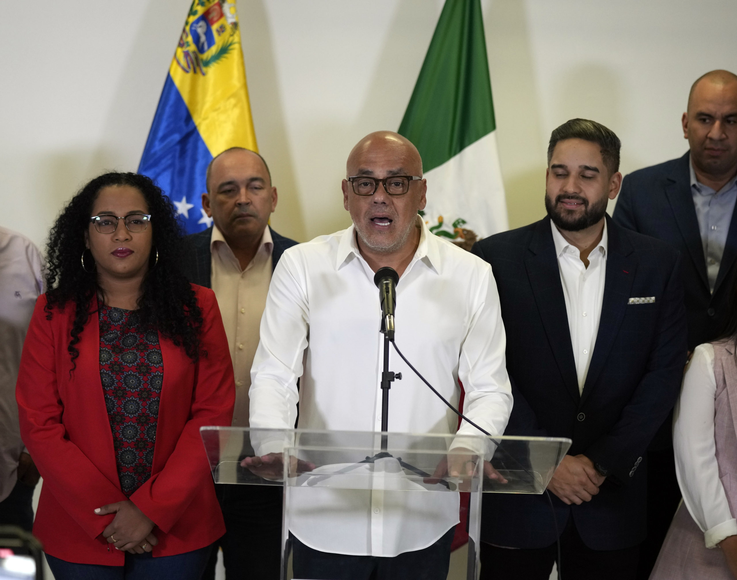 Jorge Rodriguez, center, speaks as part of the Venezuelan government delegation in Benito Juarez International Airport in Mexico City on Friday.