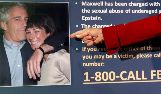 In this July 2, 2020, file photo, Audrey Strauss, acting U.S. attorney for the Southern District of New York, points to a photo of Jeffrey Epstein and Ghislaine Maxwell during a news conference in New York.