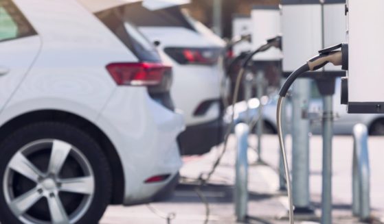 The above stock image is of an electric vehicle that is being charged.