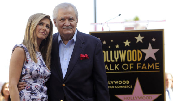Actress Jennifer Aniston poses with her father, actor John Aniston, after she received a star on the Hollywood Walk of Fame in Los Angeles on Feb. 23, 2013.