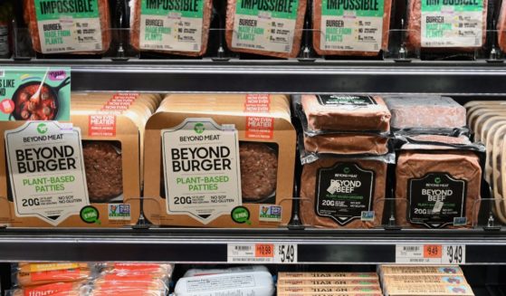 Packages of "Impossible Burger" and "Beyond Meat" sit on a shelf for sale on Nov. 15, 2019, in New York City.