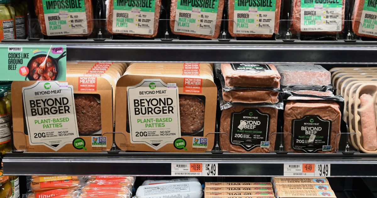 Packages of "Impossible Burger" and "Beyond Meat" sit on a shelf for sale on Nov. 15, 2019, in New York City.