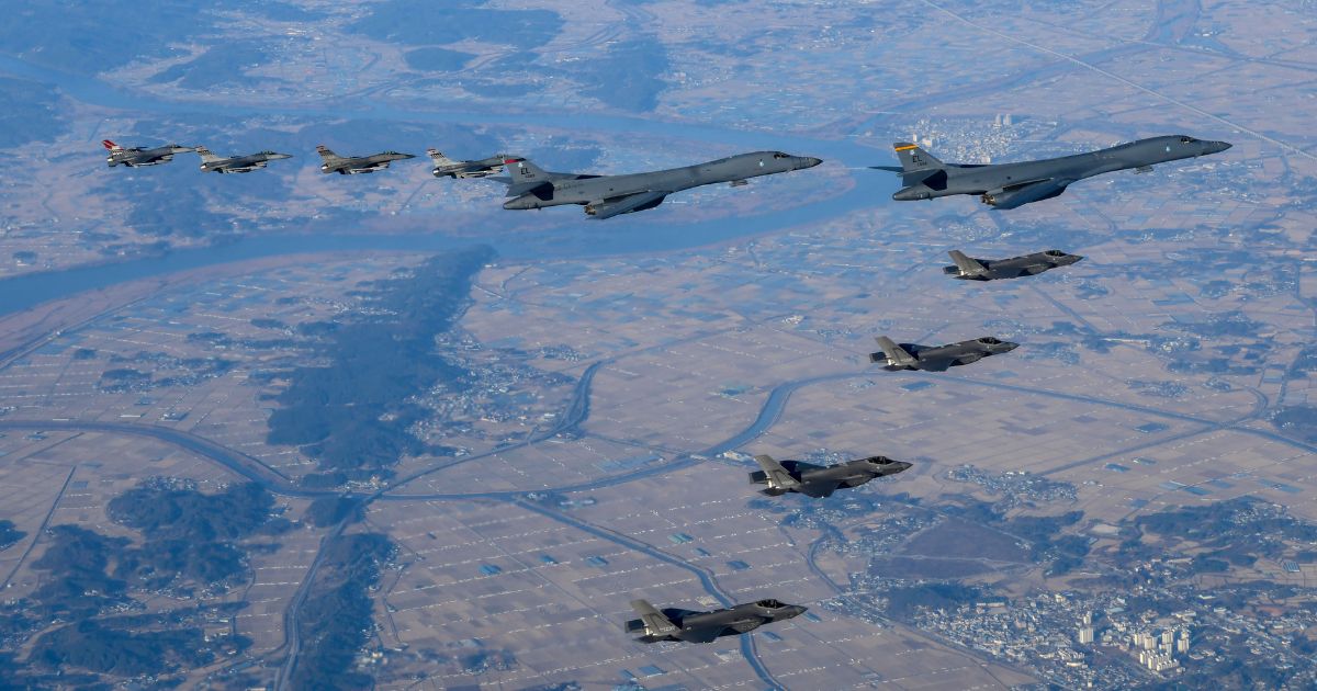 In this handout image released by the South Korean Defense Ministry, two U.S. B-1B Lancer strategic bombers, four South Korean Air Force F-35 fighter jets and four U.S. Air Force F-16 fighter jets fly over South Korea on Saturday at an undisclosed location in South Korea.