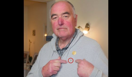 Derek Timms, a chaplain, was told he could not wear his cross pin.