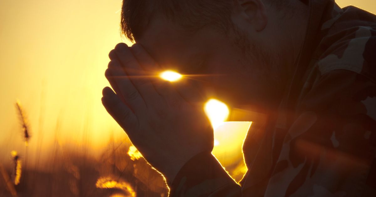 The above stock image is of a soldier praying.