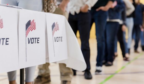 The above stock image is of people voting.