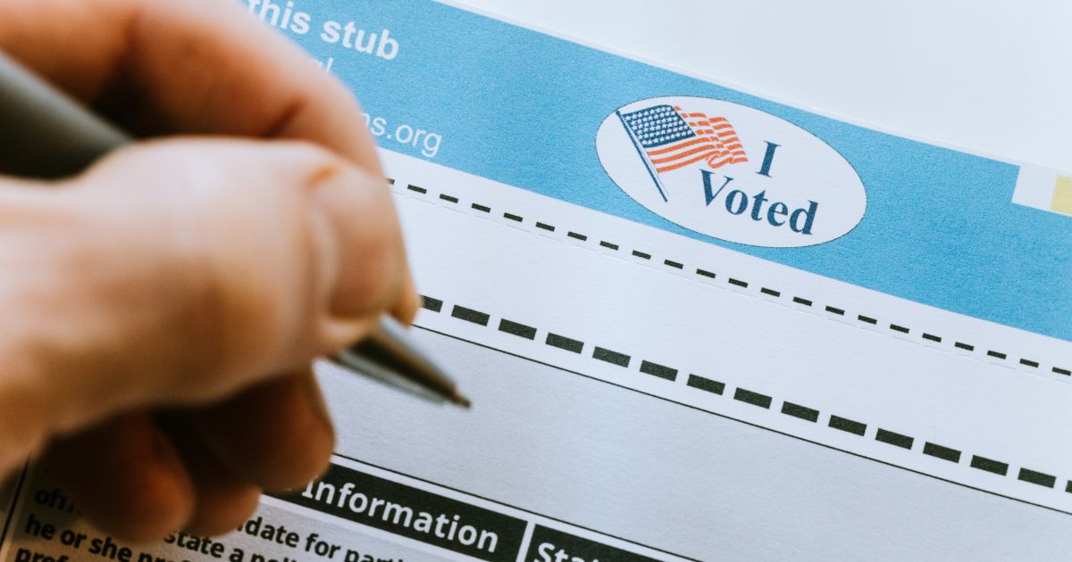 The above stock image is of someone voting.