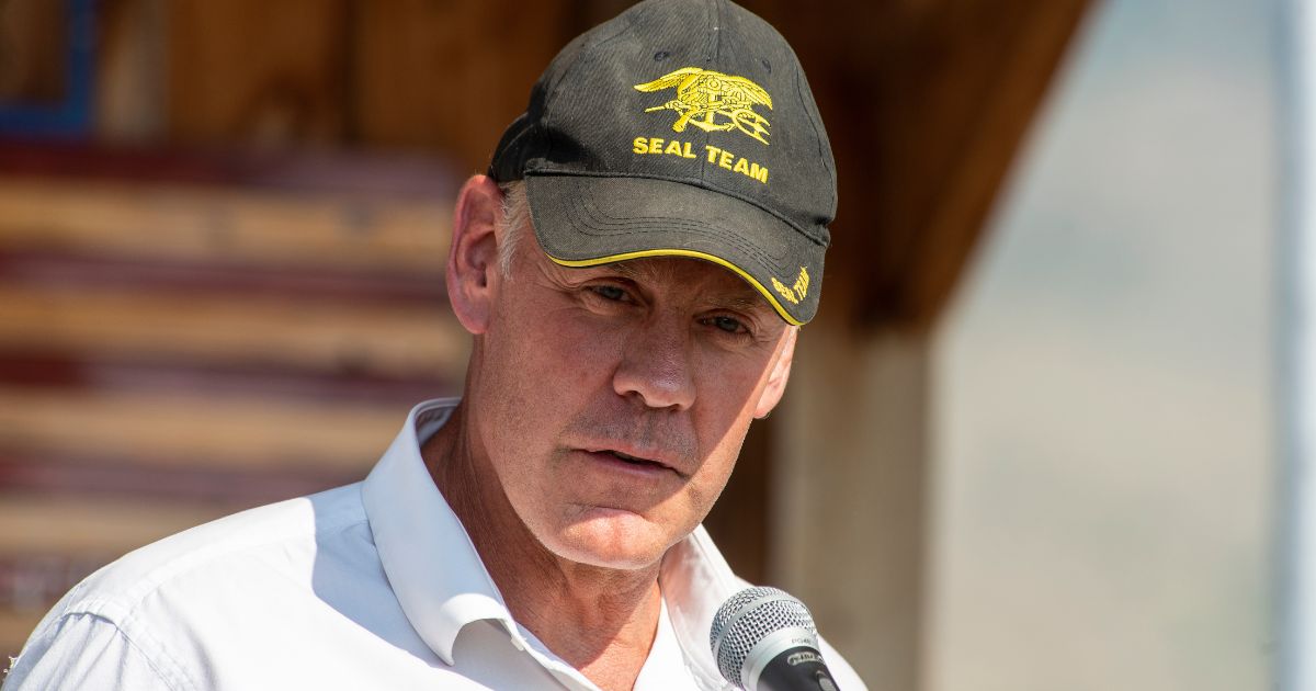 Republican Ryan Zinke speaks at the ceremony to honor the four airmen killed in a 1962 B-47 crash at 8,500 feet on Emigrant Peak on July 24, 2021, in Emigrant, Montana.