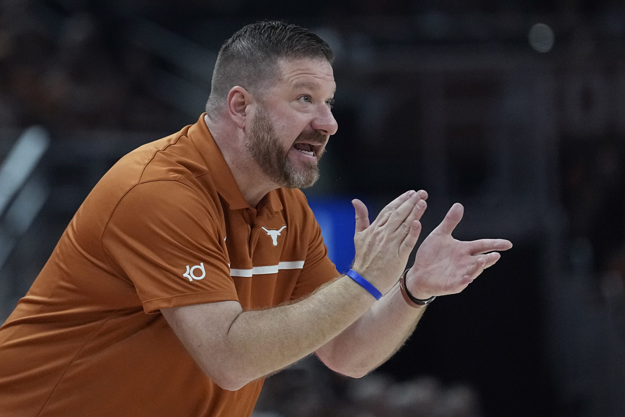 Texas head coach Chris Beard talks to his players during the first half of an NCAA college basketball game against Arkansas-Pine Bluff in Austin, Texas, on Saturday.