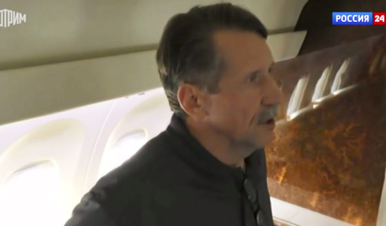 Russian citizen Viktor Bout speaks aboard a Russian plane Friday in the airport of Abu Dhabi, United Arab Emirates. Bout was freed from a U.S. prison after a swap for WNBA star Brittney Griner.