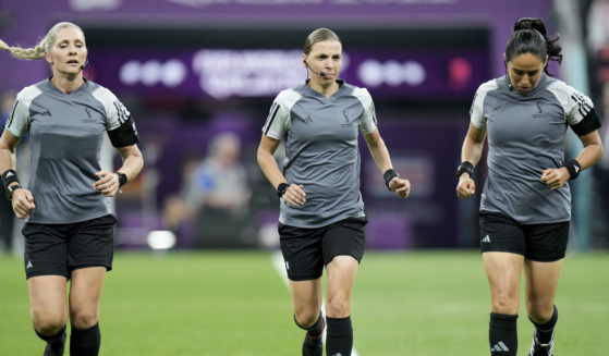 Referee Stephanie Frappart, center, and assistant referees Neuza Back, left, and Karen Diaz warm up prior to the World Cup group E soccer match between Costa Rica and Germany at the Al Bayt Stadium in Al Khor, Qatar.
