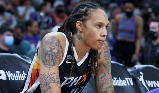 Phoenix Mercury center Brittney Griner sits during the first half of Game 2 of the WNBA Finals against the Chicago Sky on Oct. 13, 2021, in Phoenix.