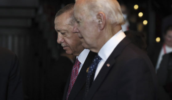 Turkish President Recep Tayyip Erdogan, left, walks with U.S. President Joe Biden, right, during the G20 leaders' summit in Bali, Indonesia, on Nov. 15.