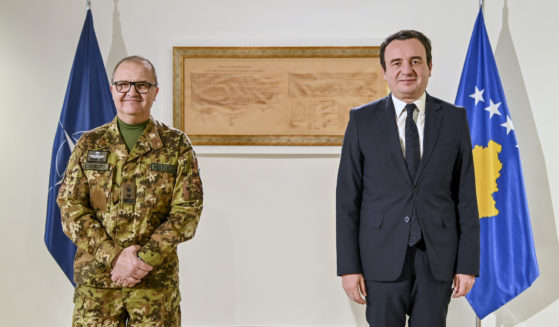 Kosovo's Prime Minister Albin Kurti, right, poses with the top NATO commander in Kosovo, Maj. Gen. Angelo Michele Ristuccia, left, in the capital Pristina, Kosovo, on Monday.