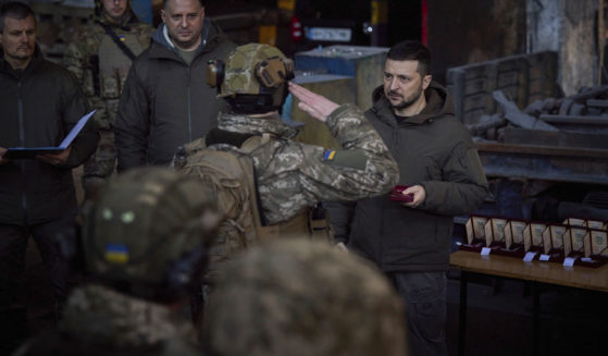 Ukrainian President Volodymyr Zelenskyy, right, awards a serviceman at the site of the heaviest battles with the Russian invaders in Bakhmut, Ukraine, on Tuesday.