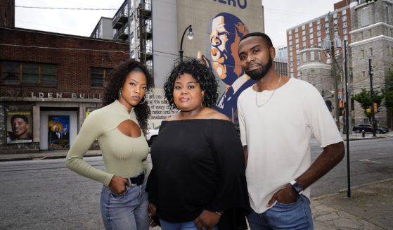 D'Zhane Parker, left, Cicley Gay, center, and Shalomyah Bowers, right, pose for a portrait on May 13 in Atlanta.
