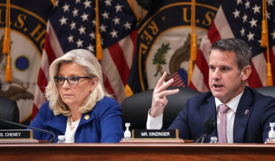 Rep. Adam Kinzinger, right, delivers remarks alongside Rep. Liz Cheney during a hearing in the Cannon House Office Building on Oct. 13 in Washington, D.C.