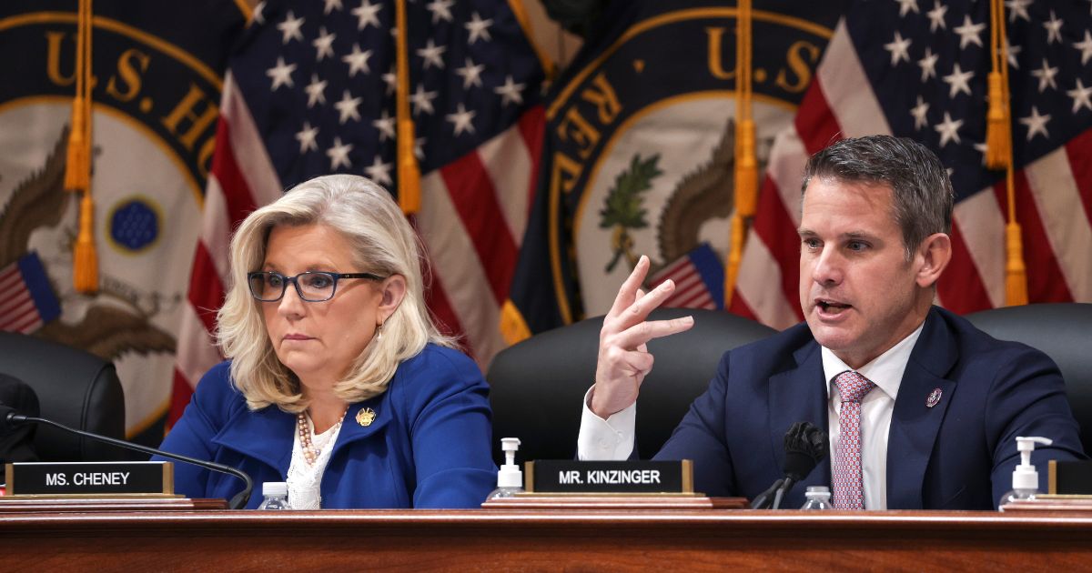 Rep. Adam Kinzinger, right, delivers remarks alongside Rep. Liz Cheney during a hearing in the Cannon House Office Building on Oct. 13 in Washington, D.C.