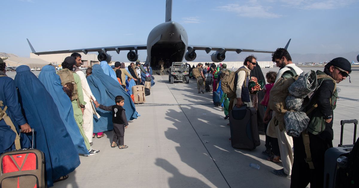 U.S. Air Force loadmasters and pilots assigned to the 816th Expeditionary Airlift Squadron load passengers aboard a C-17 Globemaster III in support of the Afghanistan evacuation at Hamid Karzai International Airport in Kabul, Afghanistan, on Aug. 24, 2021.