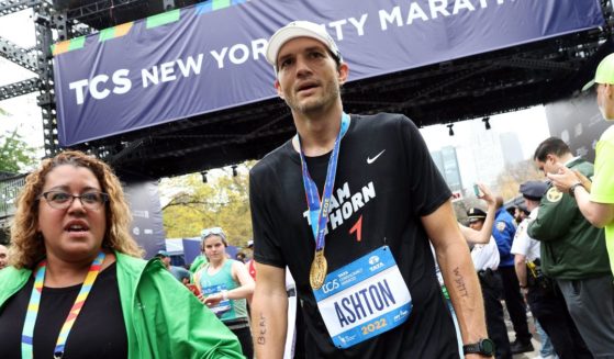 Actor Ashton Kucher catches his breath after crossing the finish line at the New York City Marathon on Nov.6. Kutcher recently revealed details about his recovery from a severe form of autoimmune disease that temporarily robbed him of his signt, hearing and ability to walk.