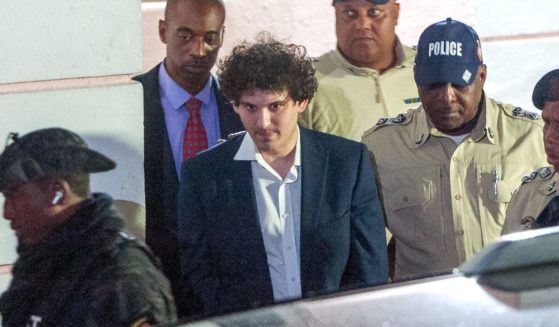 Former FTX CEO Sam Bankman-Fried s led away handcuffed by officers of the Royal Bahamas Police Force in Nassau, Bahamas, on Tuesday.
