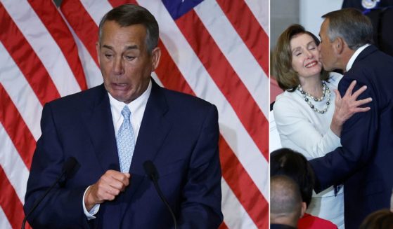 Former Speaker of the House John Boehner, an Ohio Republican, becomes emotional while talking about Speaker Nancy Pelosi (D-CA) during her portrait unveiling ceremony at the U.S. Capitol Wednesday. At right, Pelosi gets a kiss from Boehner at the ceremony.