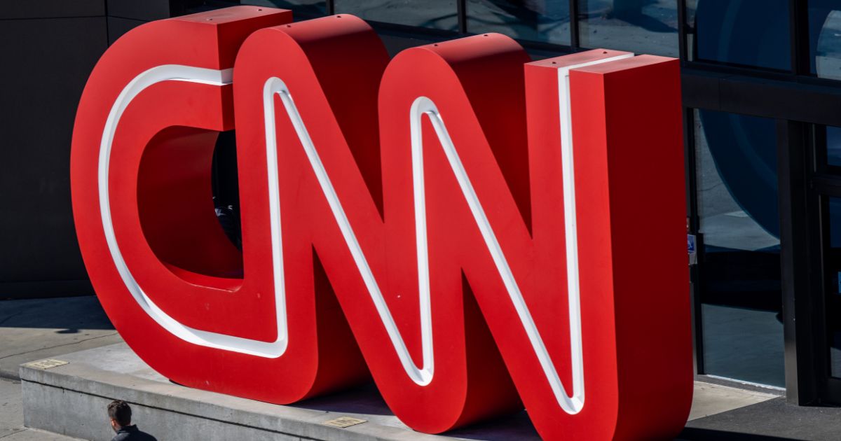 A person walks past the headquarters of the Cable News Network (CNN) on November 17, 2022 in Atlanta.