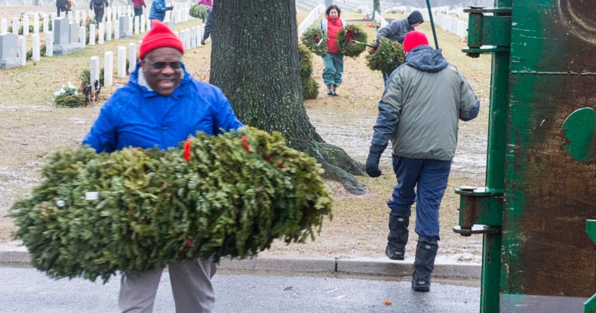 Justice Clarence Thomas cleans up Arlington National Cemetery in January 2013.