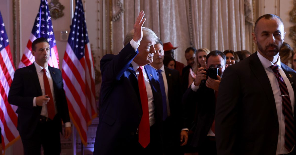 Former President Donald Trump waves after speaking at his Mar-a-Lago home on Nov. 15 in Palm Beach, Florida.