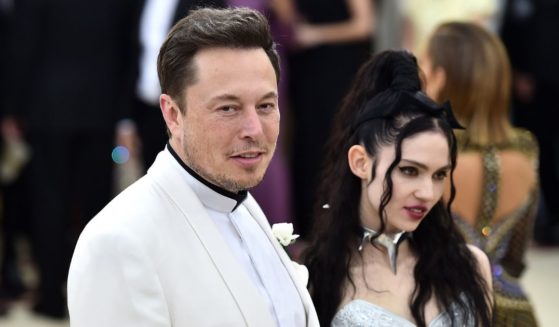 Elon Musk is pictured in a 2018 photo with Canadian singer Claire Boucher, who uses the stage name Grimes. Boucher is the mother of two of Musk's 10 children.