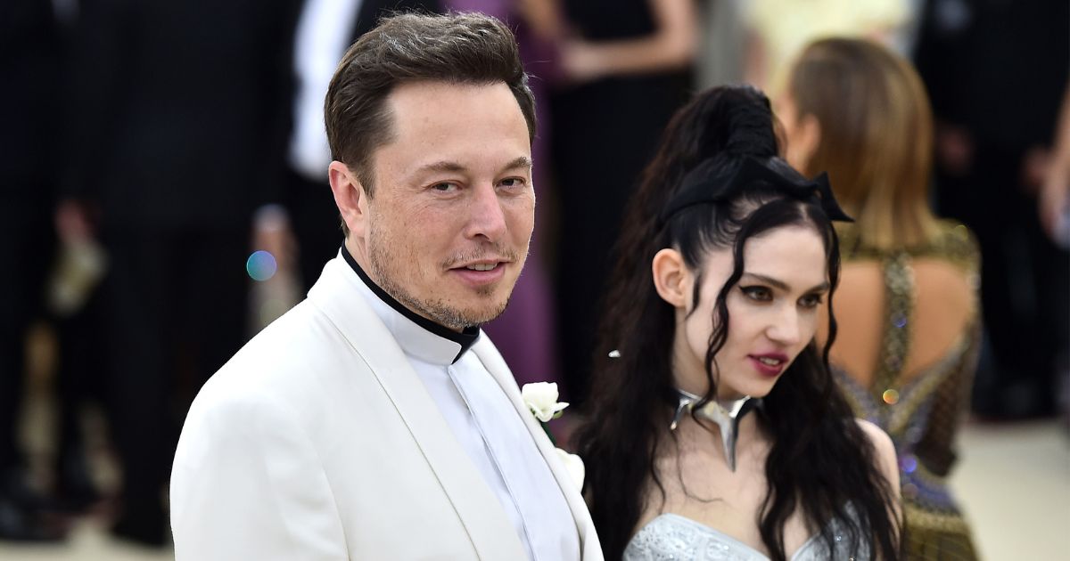Elon Musk is pictured in a 2018 photo with Canadian singer Claire Boucher, who uses the stage name Grimes. Boucher is the mother of two of Musk's 10 children.