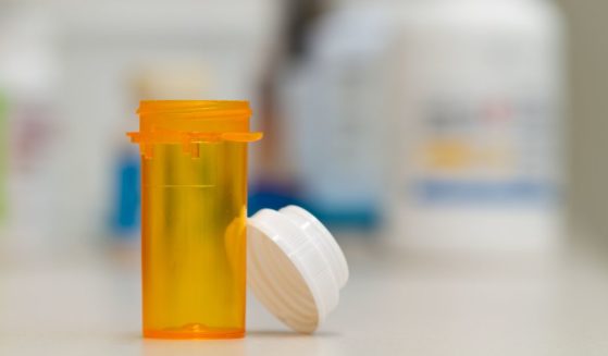 An empty prescription drug bottle is seen at a pharmacy