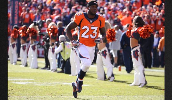 Former Denver Broncos running back Ronnie Hillman (23) is seen in a file photo running onto the field during the NFL AFC Championship playoff football game between the Denver Broncos and the New England Patriots on January 24, 2016. Hillman's family has said the 31-year-old has cancer and is on hospice care.